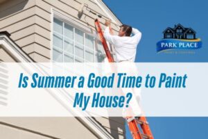 man painting the house exterior during summer with a caption Is Summer a Good Time to Paint My House?